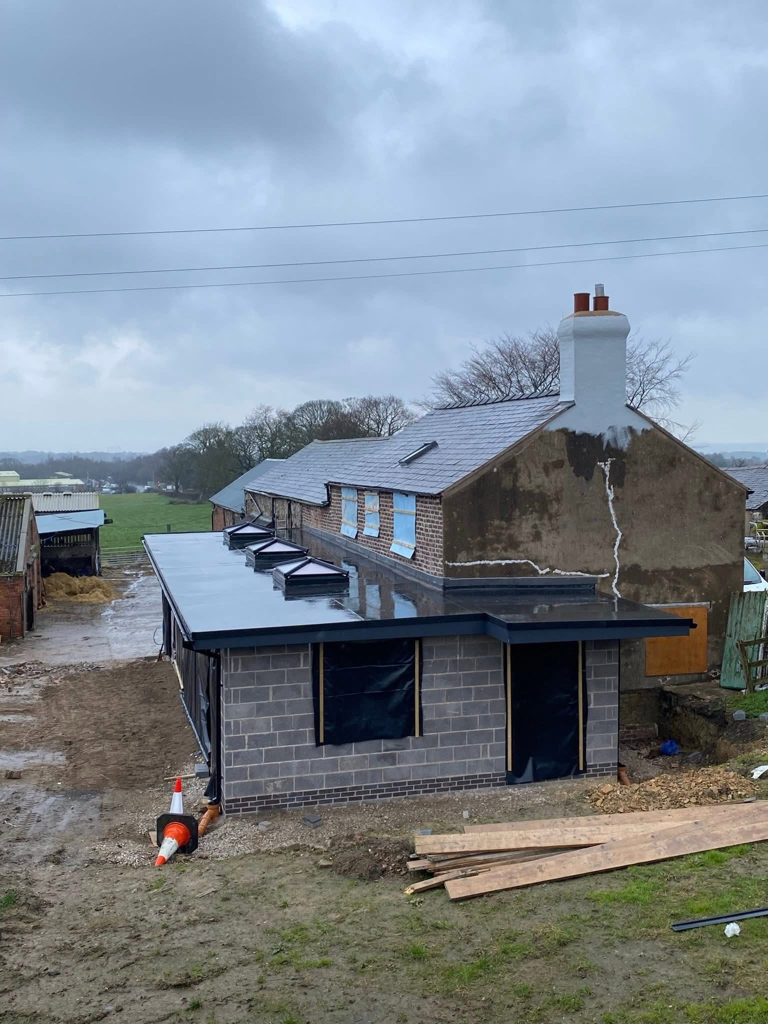 Flat roofing installation using EPDM rubber on a modern home extension by Onyx Roofing