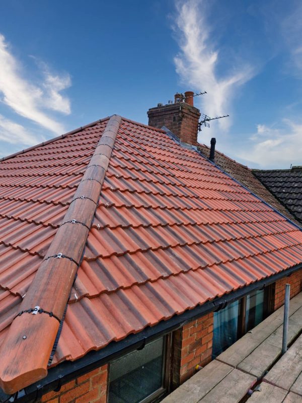 Professional roof replacement by Roofers in North Wales using new concrete roof tiles